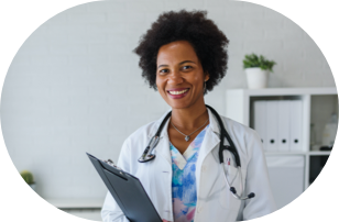 A doctor who is smilling with a stethoscope around her neck